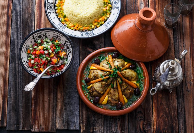 Moroccan cuisine chicken tajine, couscous, and salad