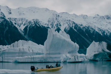 Small boat carries photographer Chris Burkard to a glacier
