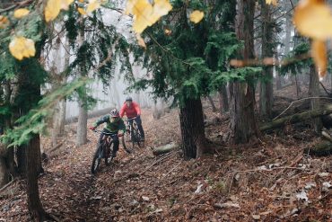 Two men riding mountain bikes in the Minami Alps of Japan on Specialized bikes
