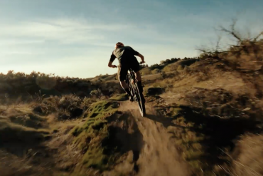 A man riding his new Niner JET 9 RDO mountain bike on a singletrack trail