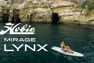 Girl paddling Hobie kayak in crystal clear water