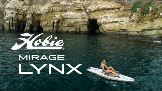 Girl paddling Hobie kayak in crystal clear water