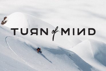 A man splitboarding on a big snowy mountain in the Swiss Apls