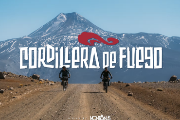 Two mountain bikers riding a dirt trail in Cordillera de Fuego