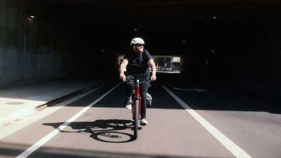 A man riding his Trek Allant+ eBike in the bike lane