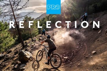 Three PRO mountain bikers riding a technical singletrack in Morocco's Atlas Mountains