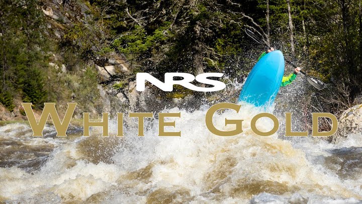 A whitewater kayaker paddling a rough river in Idaho