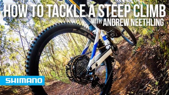 climbing a steep dirt trail on a mountain bike