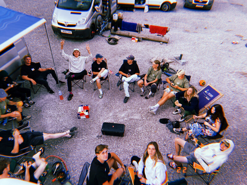 A group of cyclists gathering around the camera in Morzine, France