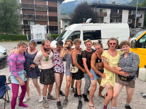 A group of cyclists gathering around the camera in Morzine, France