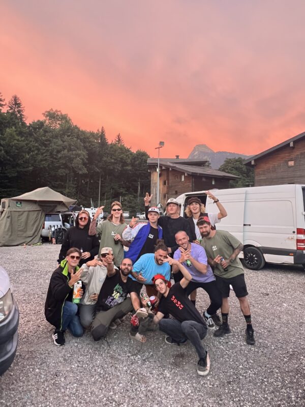 A group of cyclists gathering around the camera in Morzine, France