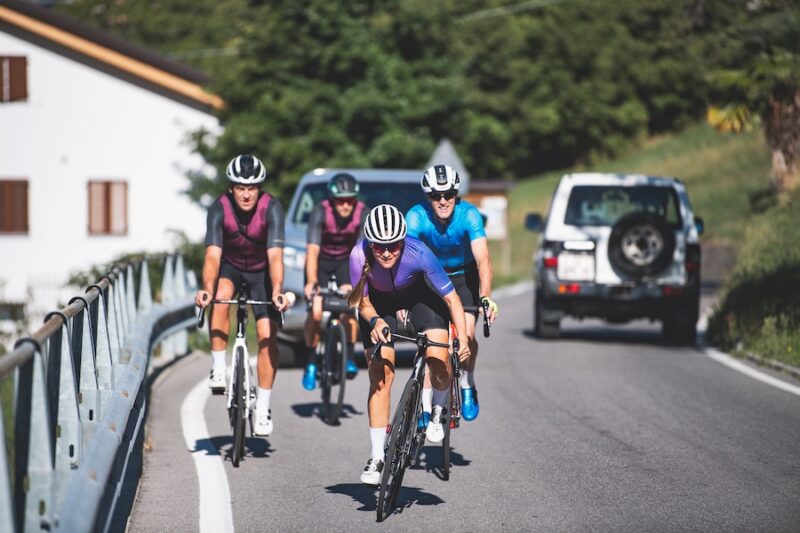 Pro cyclist Nikky Alberts on a training ride during her pregnancy with three other cyclists.