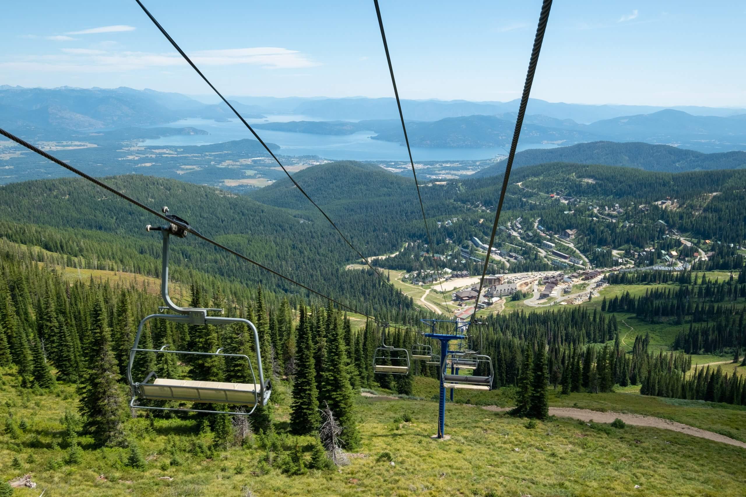 A scenic view of Schweitzer Resort from the top of the mountain, looking down the scenic chairlift.