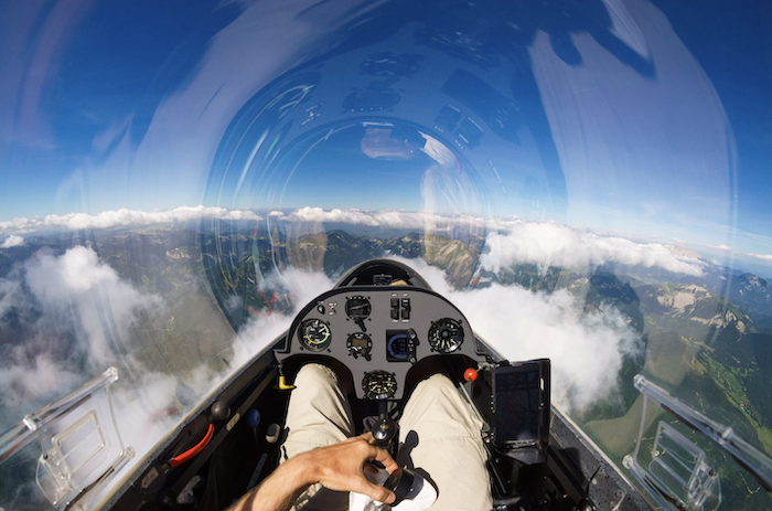 A glider pilot from SoaringNV glides over the Sierra Nevada from his cockpit.
