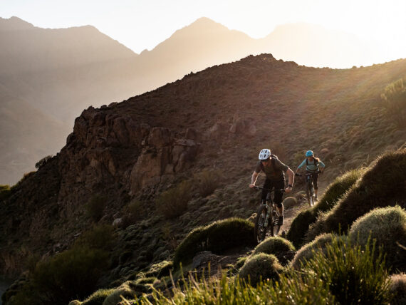 Dan Milner riding his mountain bike on high-altitude singletrack.