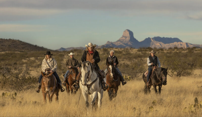 A group on horses in the Southern Arizona Desert