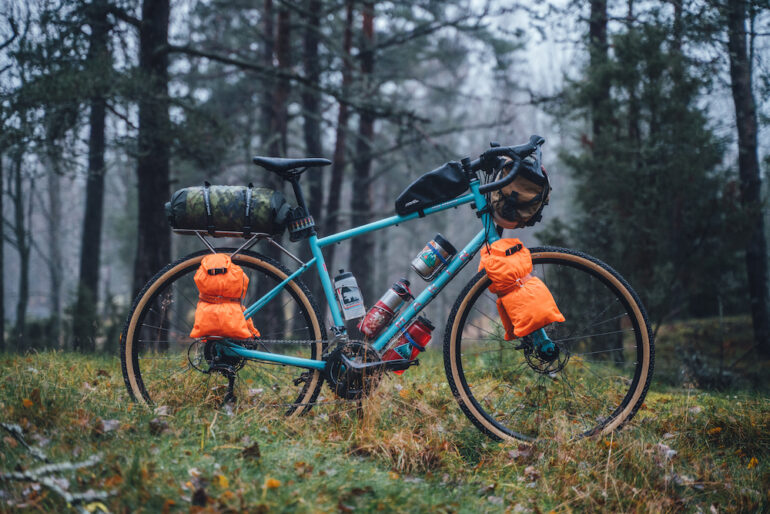 Marin Four Corners 1 loaded with bags in a rainy forest