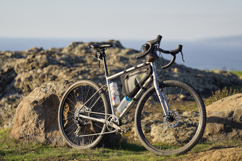 Side angle image of the upgraded Marin Four Corners 2 on rocky trail