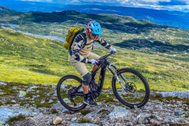 Hans Rey riding a rocky trail at a dreamy mountain bike park in Hogevarde, Norway