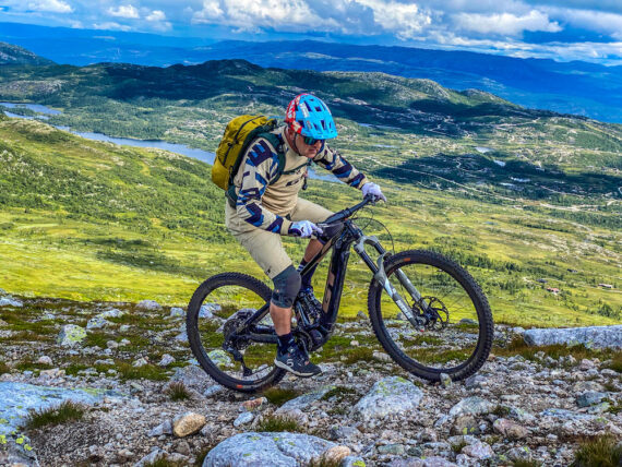 Hans Rey riding a rocky trail at a dreamy mountain bike park in Hogevarde, Norway