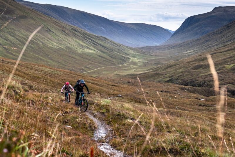 Two mountain bikers ride deep into the Scottish countryside via endless single track.