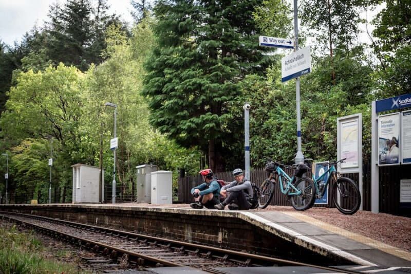 Dan and Alex waiting for the train with their bikes.