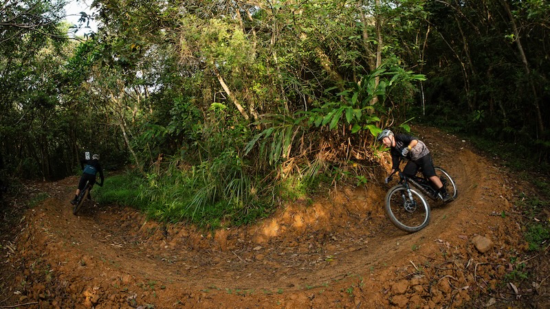 Mountain biker flows through a perfect corner on single track in Taiwan