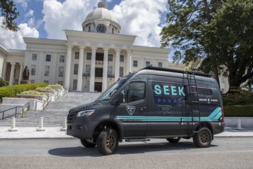 SEEK AL camping Sprinter van wrapped in matte black.